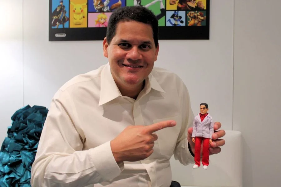 reggie holding figurine