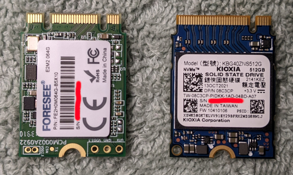 nvme drives (stock 64 GB on left, aftermarket on right)